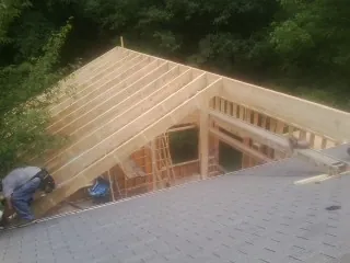Framing a new roof addition that ties into an existing shingle roof in Climax
